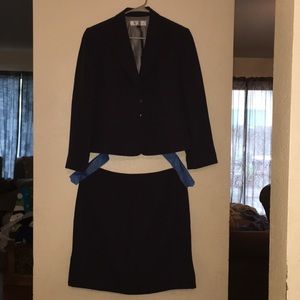 Tahari pinstriped women’s jacket and skirt suit.